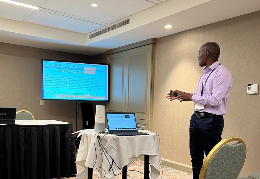 Marco Kitundu presenting research at a conference