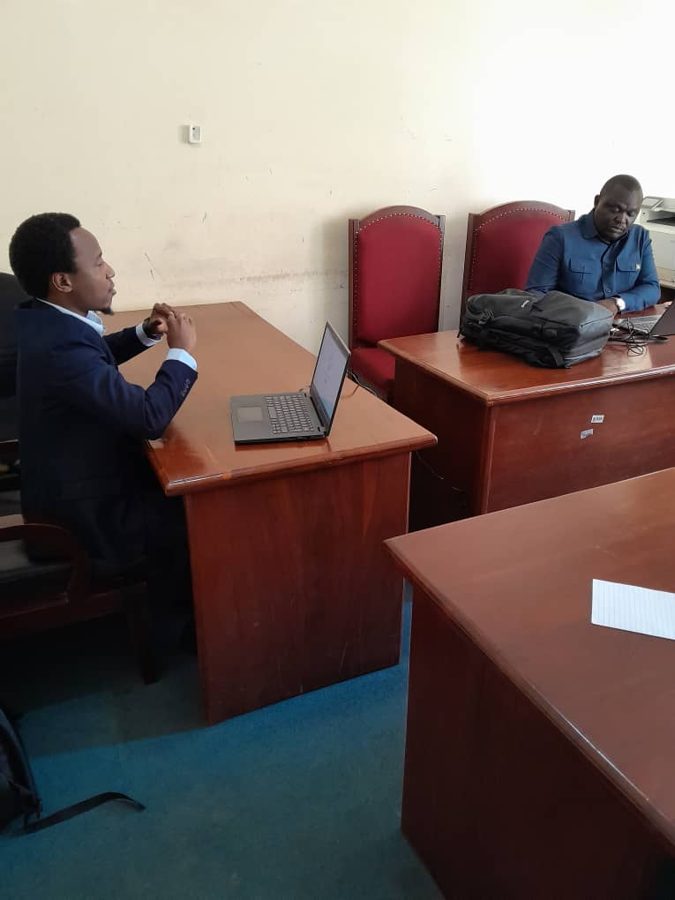 Afya Yako researchers meeting with Tanzanian health officials